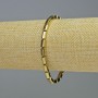 Bracelet en hématite rectangulaire couleur dorée, diamètre 8×4 mm ±, longueur 18 cm ±, élastique