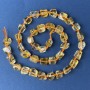 Perles de citrine polyédriques 10–8 mm, sur fil, longueur 40 cm+