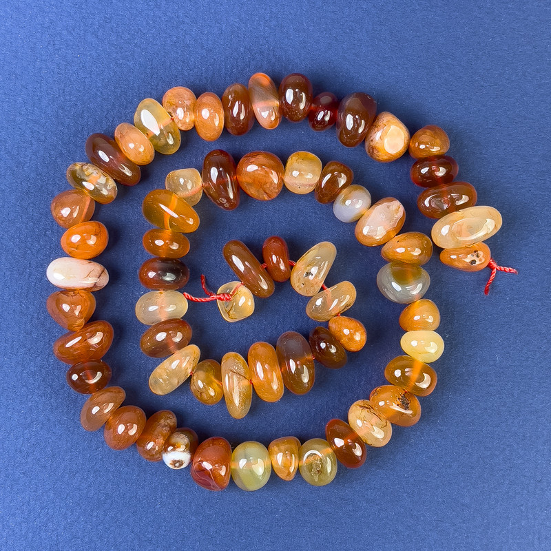 Perles de cornaline facetées 10×7 mm ± sur fil, longueur 40 cm+