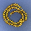 Perles d'ambre taillées 6×4 mm sur fil