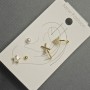 Boucles d'oreilles puces et cuffs pour l'oreille en métal doré avec strass blancs
