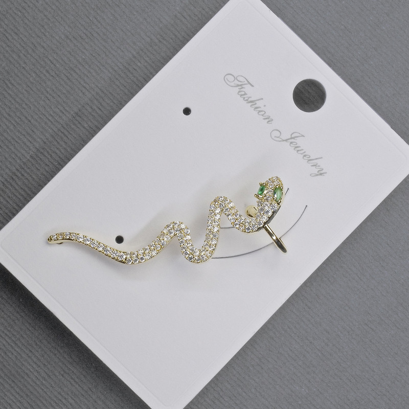 Boucle d'oreille manchon dorée, longueur 41 mm ±, strass blancs et verts