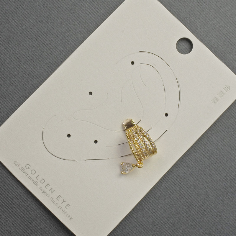Boucle d'oreille-puce caf en métal doré, 10x14 mm ± strass blancs