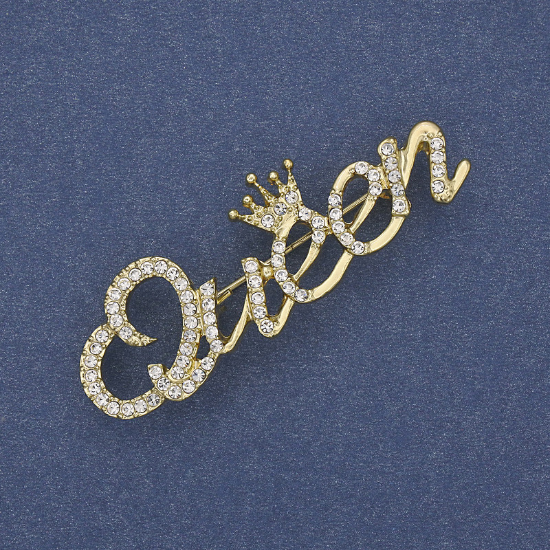 Broche Accent «Reine» en métal doré avec strass 48×16 mm+