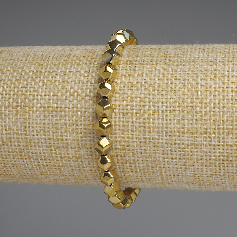 Bracelet en hématite couleur or facetté 6 mm ±, longueur 18 cm ±, élastique