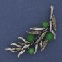 Broche Branche verte Œil de chat vert, strass gris, 67 × 26 mm, métal argenté