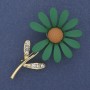 Broche Marguerite émaillée verte avec strass blancs et métal doré 65×39 mm+