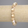 Bracelet beige en nacre, perles rondes lisses, diamètre environ 8,5 mm, longueur 18 cm, élastique
