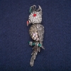 Broche «Cacatoès» 7×1,5 cm métal gris