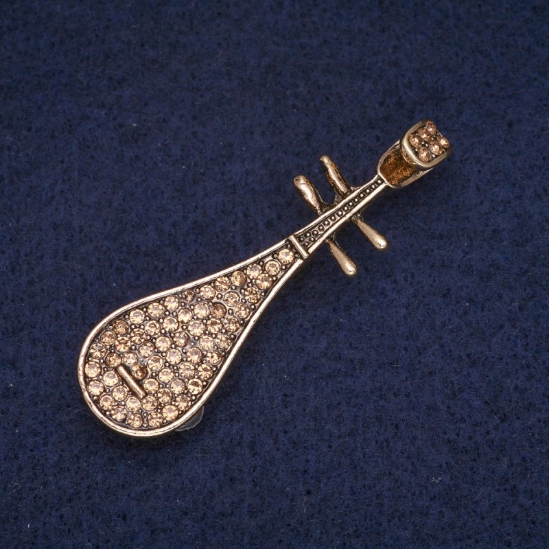 Broche «Pipa» avec strass jaunes, métal doré 15×50 mm