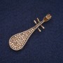 Broche «Pipa» avec strass jaunes, métal doré 15×50 mm