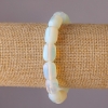 Bracelet en pierre lunaire barillet sur élastique 10×14 mm, tour de poignet 18 cm