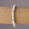 Bracelet en howlite sur élastique, perles rondes lisses de 6 mm de diamètre, longueur 18 cm