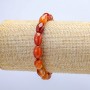 Bracelet élastique en cornaline barillet, diamètre 8 × 12 mm ±, longueur 18 cm+