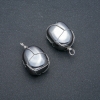 Pendentif en tressage argenté avec hématite, diamètre 30×22 mm+