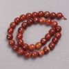 Perles sur fil – Agate orange facettée boule, diamètre 10 mm ±, longueur 38 cm ±