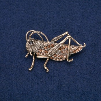 Broche Sauterelle dorée en métal avec strass noirs et jaunes 57x38 mm +
