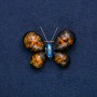 Broche Papillon doré avec ambre et strass bleu