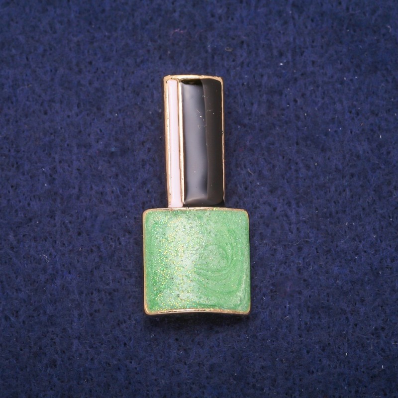 Broche «Laqué» vert, émail noir et blanc, métal doré 18x39 mm