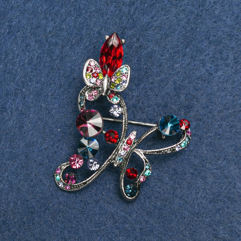 Broche papillon argenté en métal et strass 50 mm +
