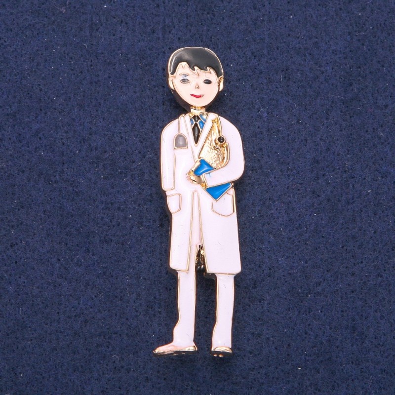 Broche «Frère médecin» émaillée blanche, métal doré 17×62 mm