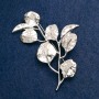 Broche «Branche avec feuilles», métal argenté 62 × 40 mm