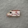 Broche «Rapide» émail blanc, métal doré 18×32 mm+