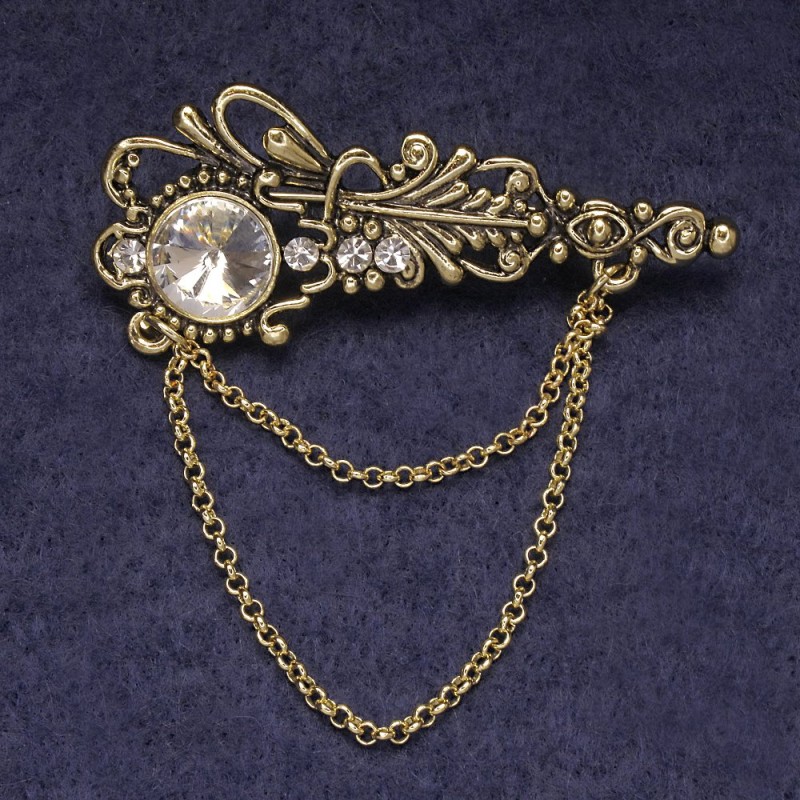 Broche Accent, strass blancs et cristal, métal doré 55×22 mm
